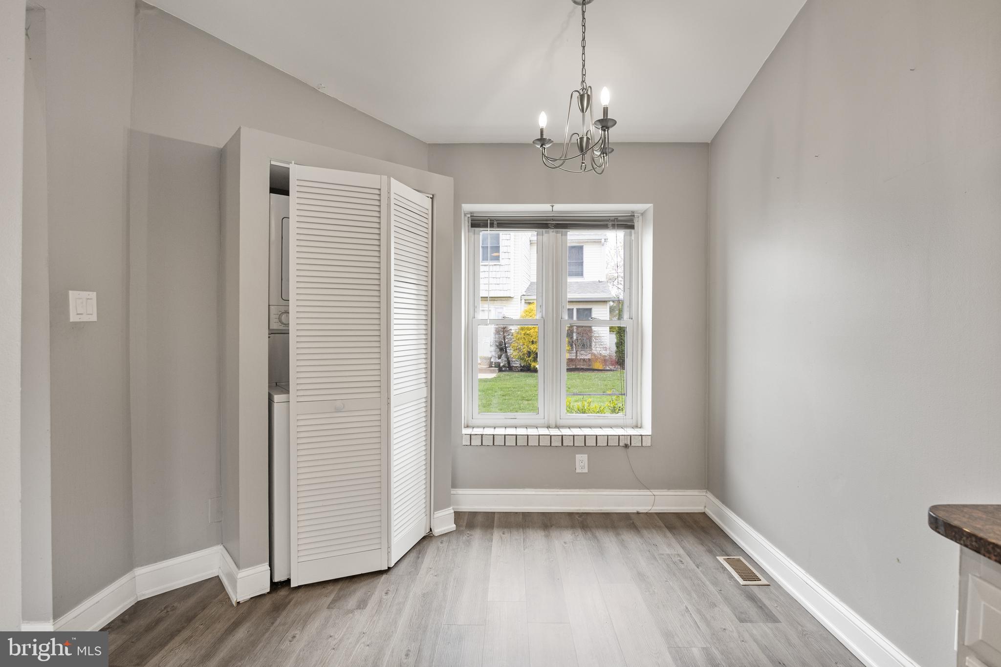 118 Suburban Boulevard Delran, NJ 08075 - Photo 10 of 36 a view of an empty room with wooden floor and a window