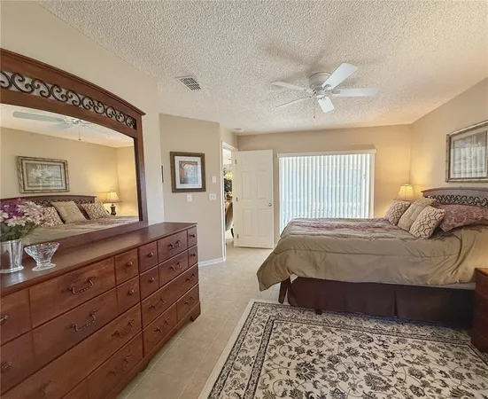a bathroom with a granite countertop sink a toilet and a mirror