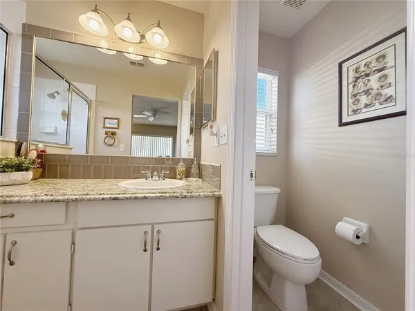 a bed room with a bed and a chandelier