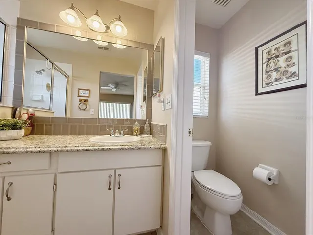 a bed room with a bed and a chandelier