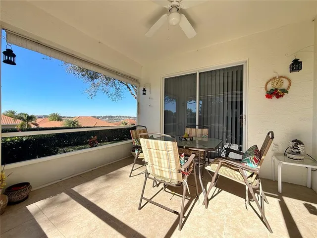 a view of a house with backyard and porch