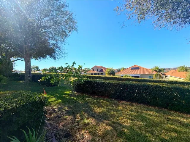 an aerial view of a house with yard swimming pool and outdoor seating