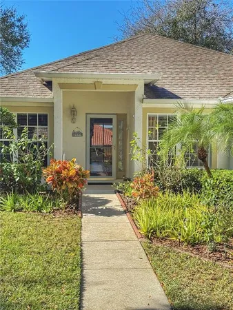 an aerial view of residential house with outdoor space and lake view