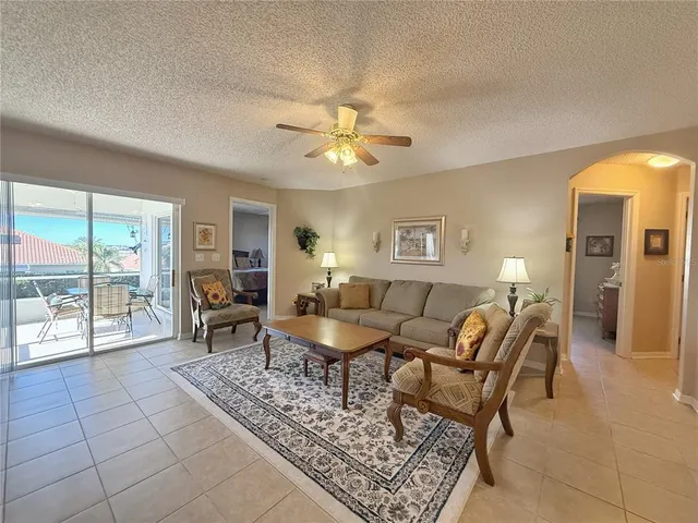 a living room with furniture and a table