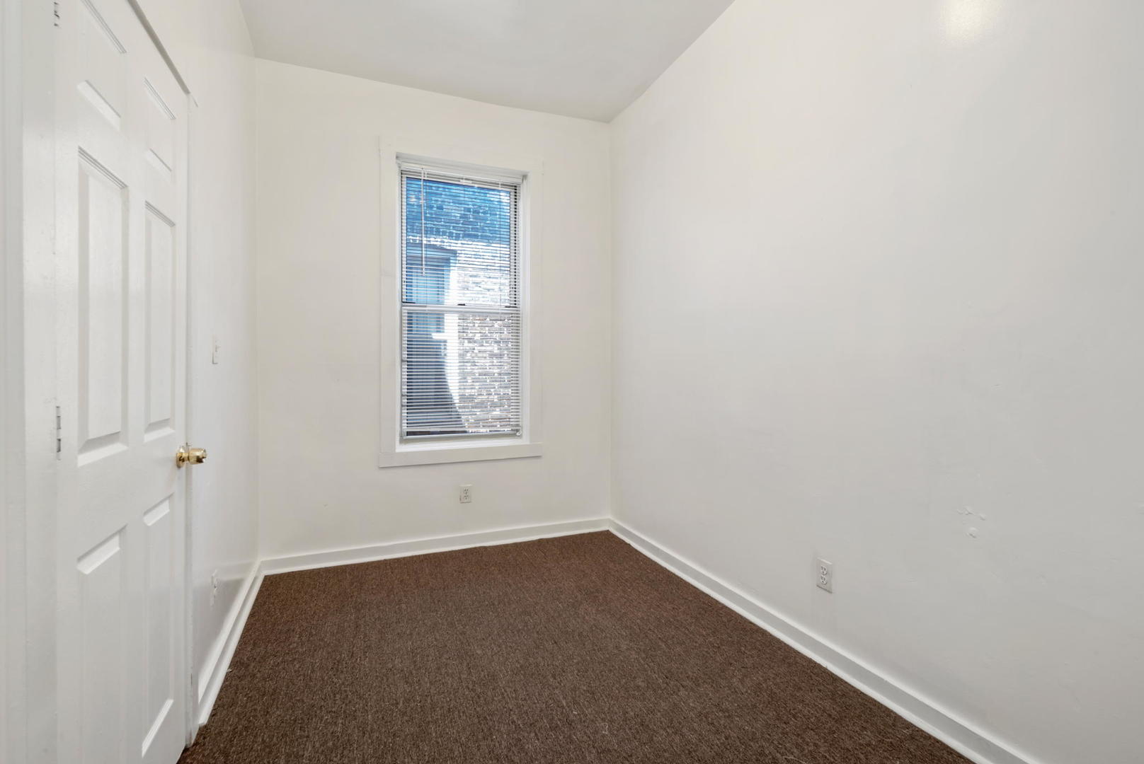 1455 South Avers Avenue Chicago, IL 60623 - Photo 11 of 22 a room that has a window in it
