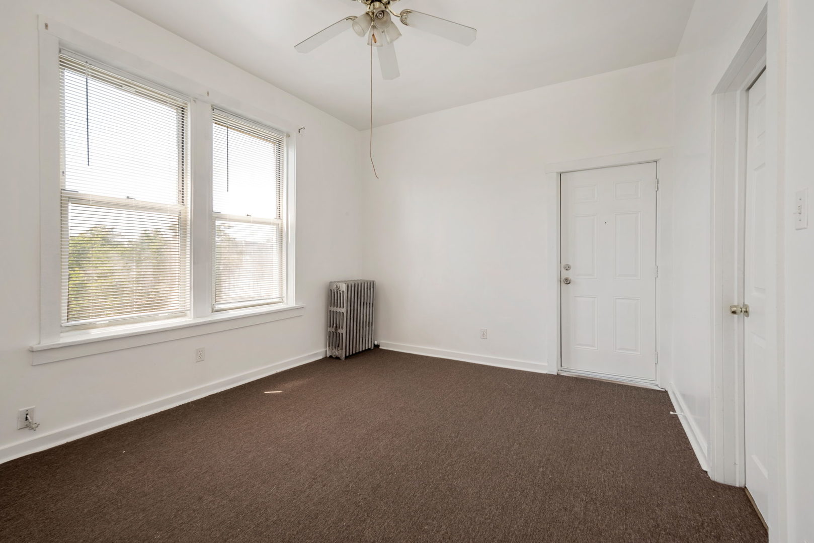 1455 South Avers Avenue Chicago, IL 60623 - Photo 12 of 22 a view of an empty room with a window