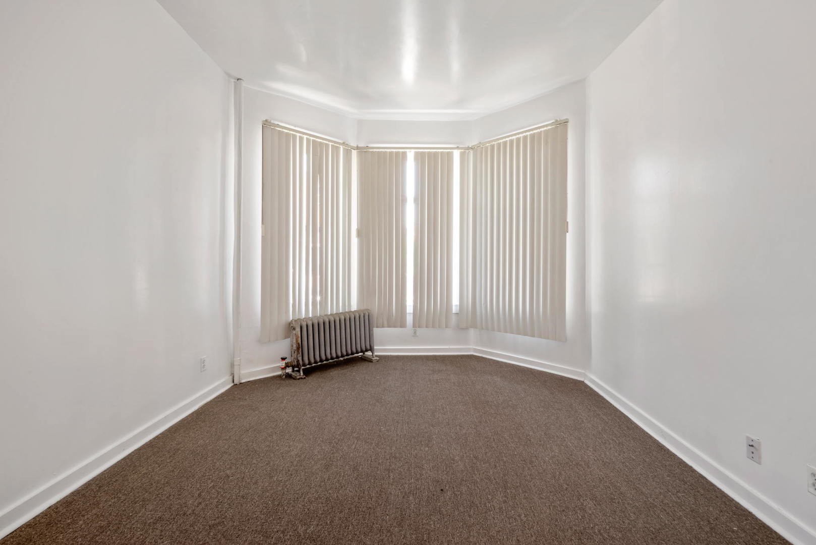 1455 South Avers Avenue Chicago, IL 60623 - Photo 18 of 22 an empty room with a empty space and a window