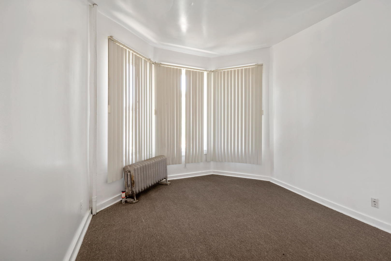 1455 South Avers Avenue Chicago, IL 60623 - Photo 19 of 22 an empty room with a empty space and a window