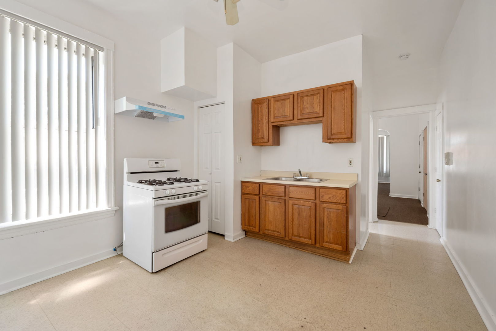 1455 South Avers Avenue Chicago, IL 60623 - Photo 9 of 22 a kitchen with stainless steel appliances a stove a sink and a refrigerator