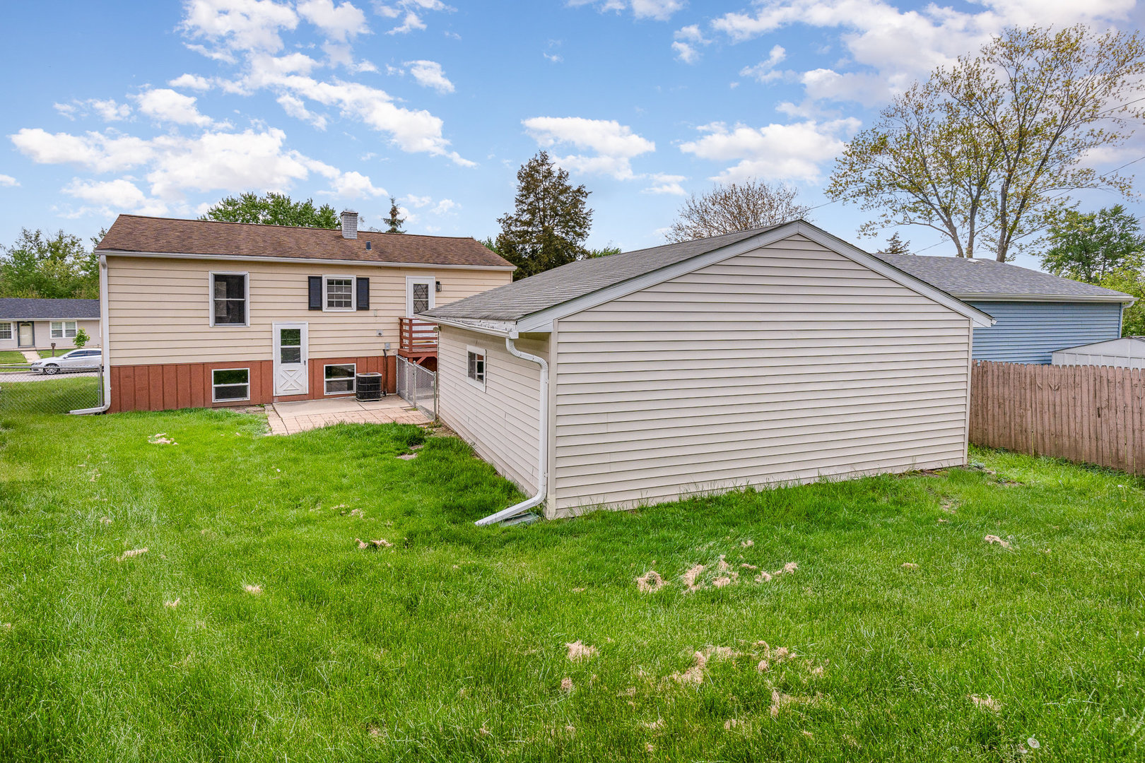 138 Cedar Circle Streamwood, IL 60107 - Photo 15 of 15 a front view of a house with garden