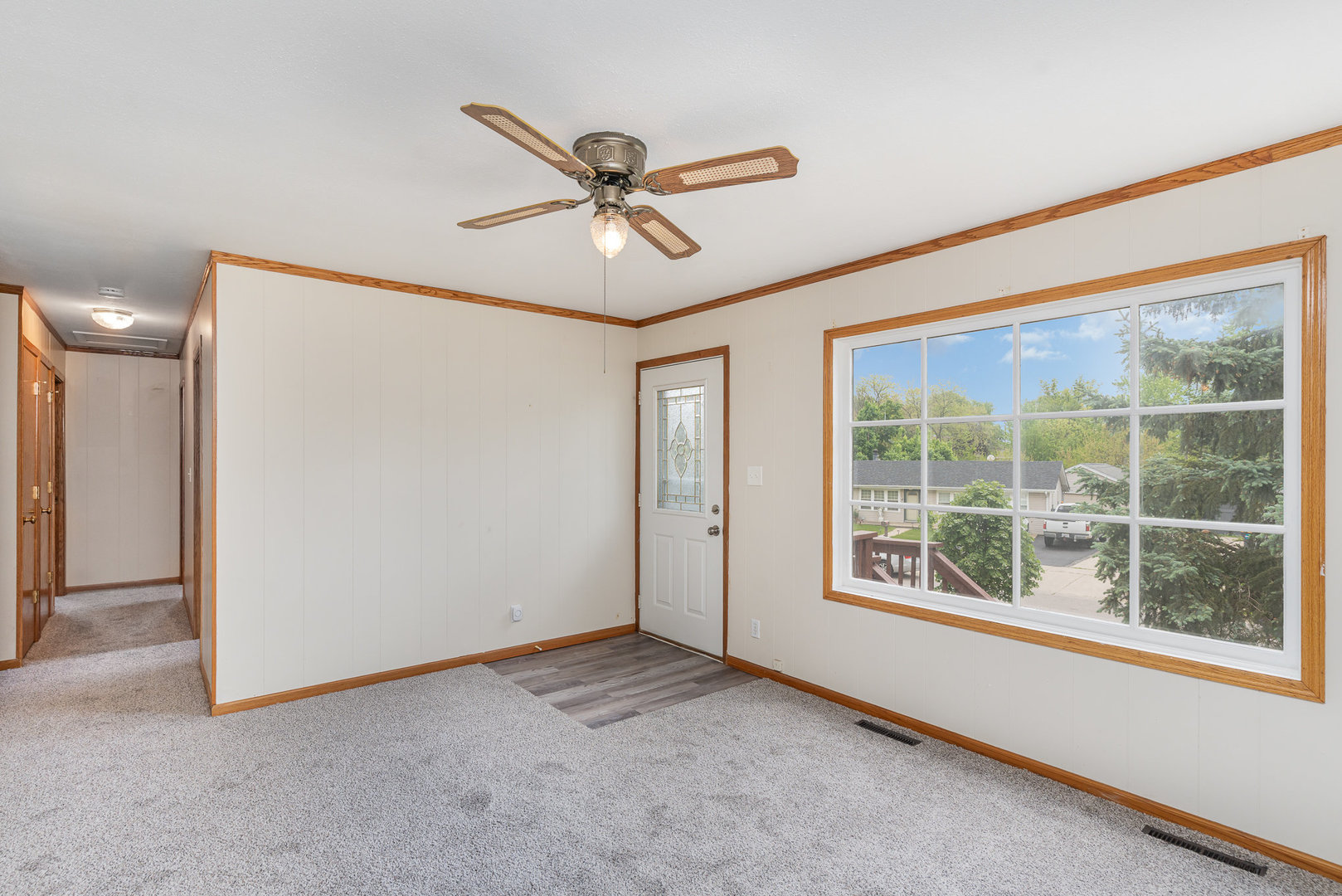 138 Cedar Circle Streamwood, IL 60107 - Photo 2 of 15 a view of an empty room with a window