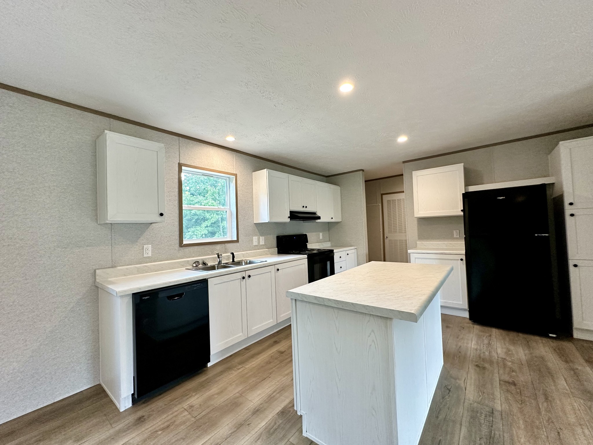 1667 Rabe Coats Road Westmoreland, TN 37186 - Photo 14 of 20 a kitchen with a refrigerator and a stove top oven