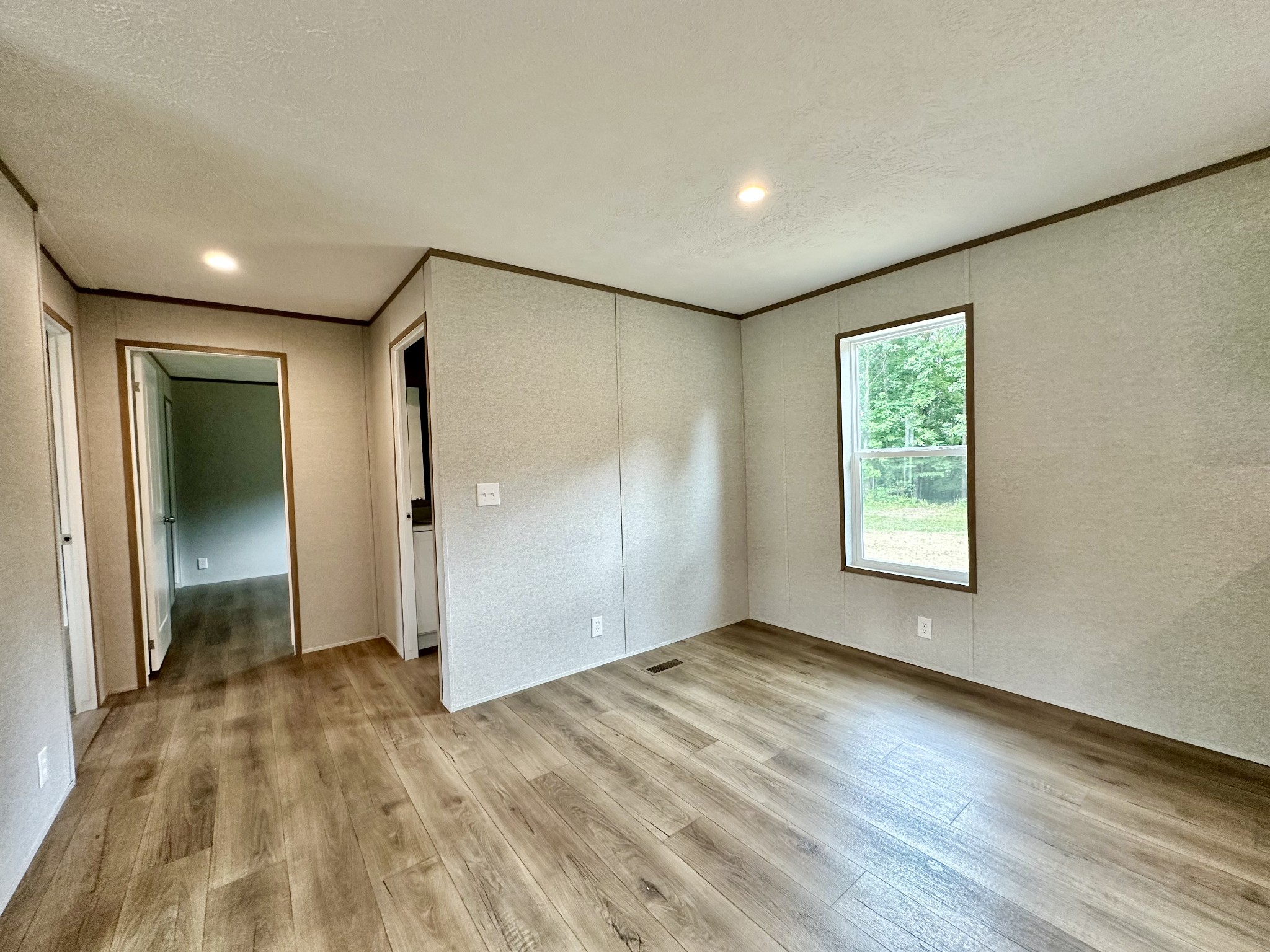 1667 Rabe Coats Road Westmoreland, TN 37186 - Photo 15 of 20 wooden floor in an empty room with a window