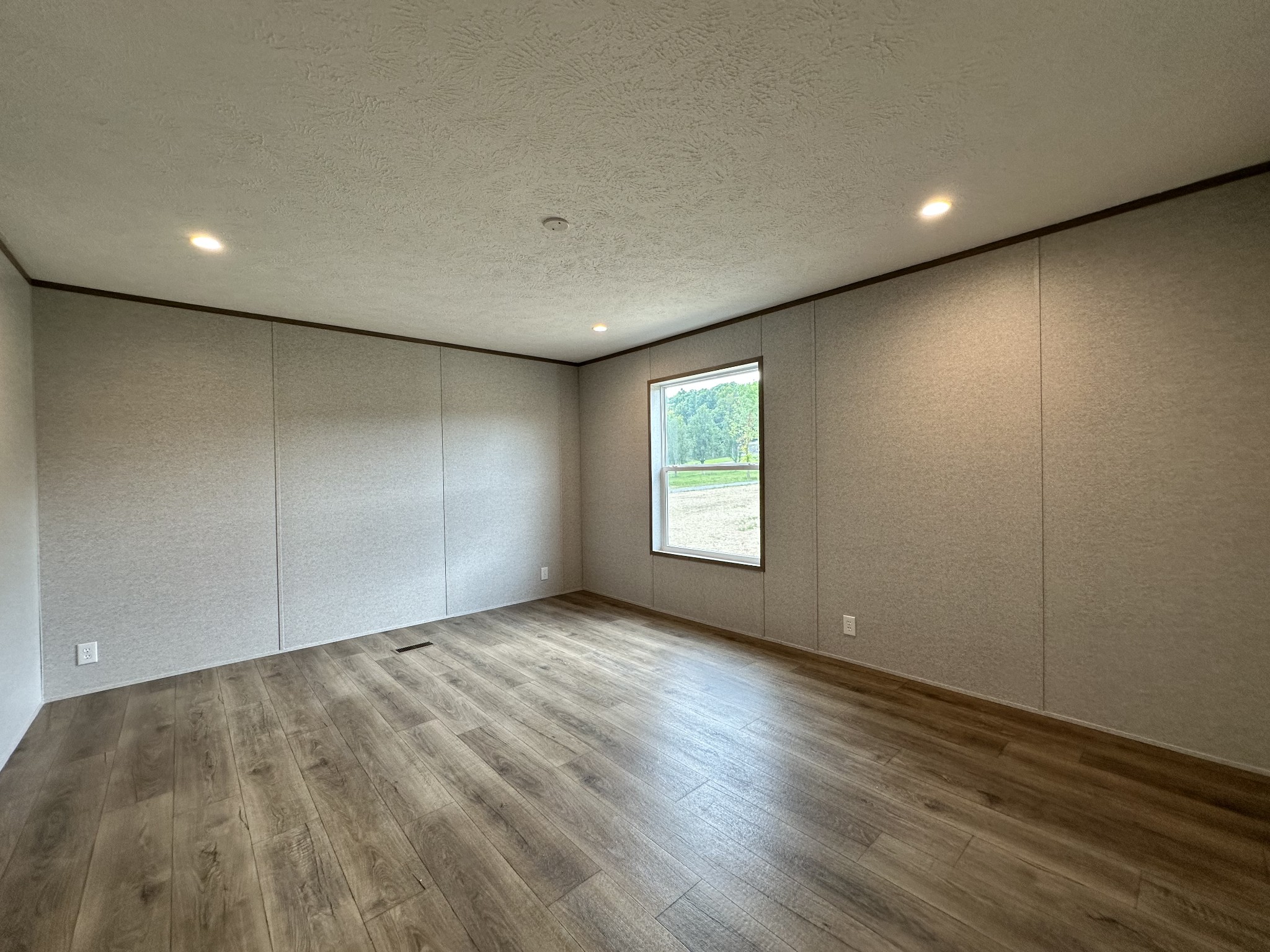 1667 Rabe Coats Road Westmoreland, TN 37186 - Photo 16 of 20 an empty room with wooden floor and windows
