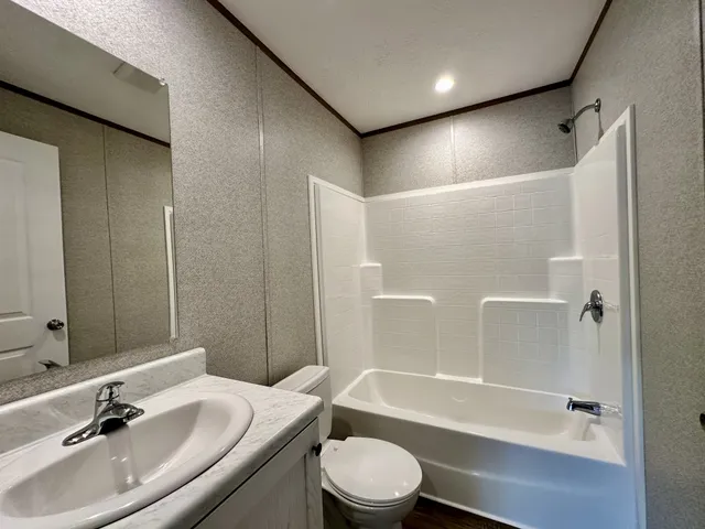 a bathroom with a sink toilet bathtub and shower
