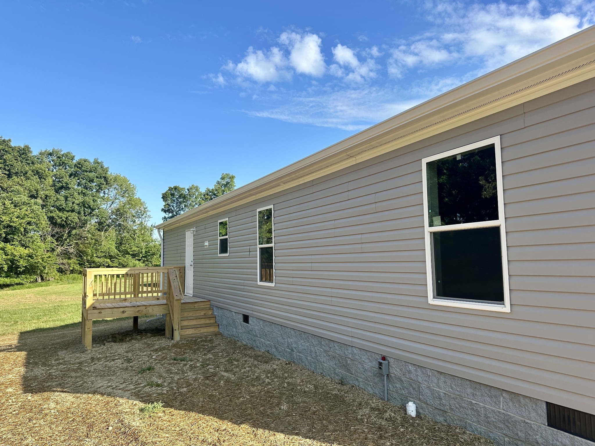 1667 Rabe Coats Road Westmoreland, TN 37186 - Photo 3 of 20 a view of a house with a yard
