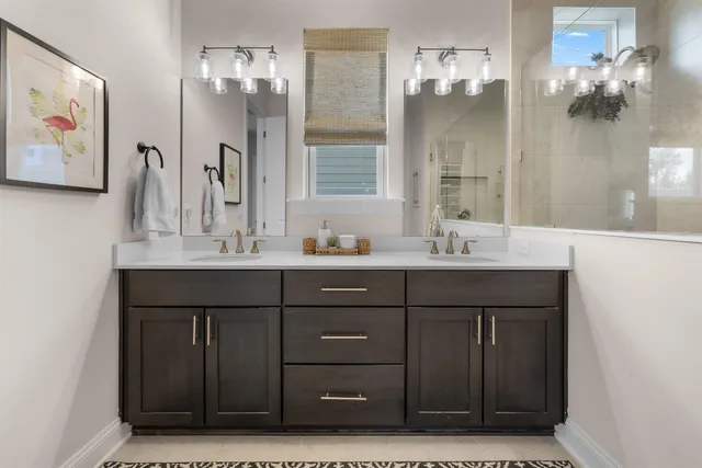 a bathroom with a sink vanity and a mirror