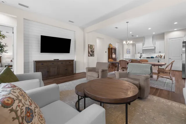 a living room with fireplace furniture and a flat screen tv