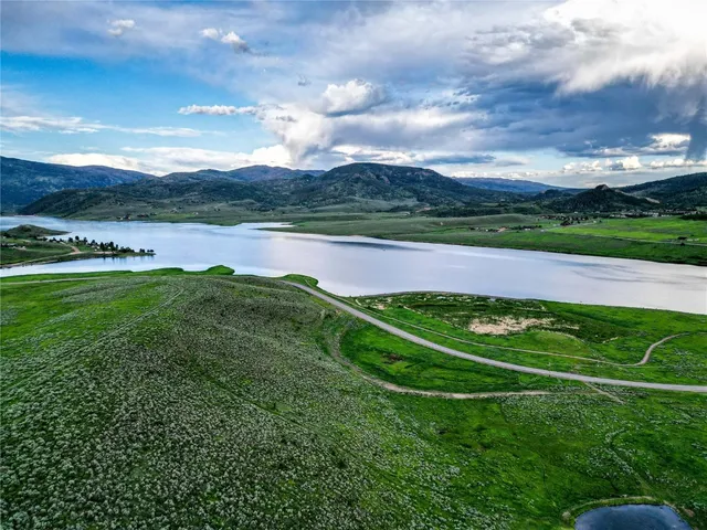 a view of a golf course with a lake