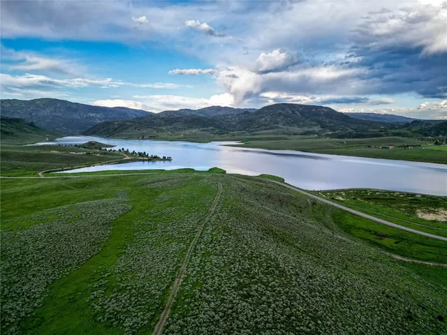 a view of a lake with a yard