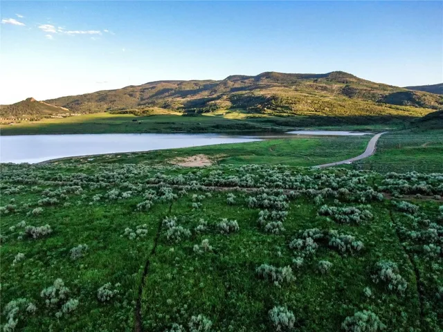 a view of a town with mountains in the background