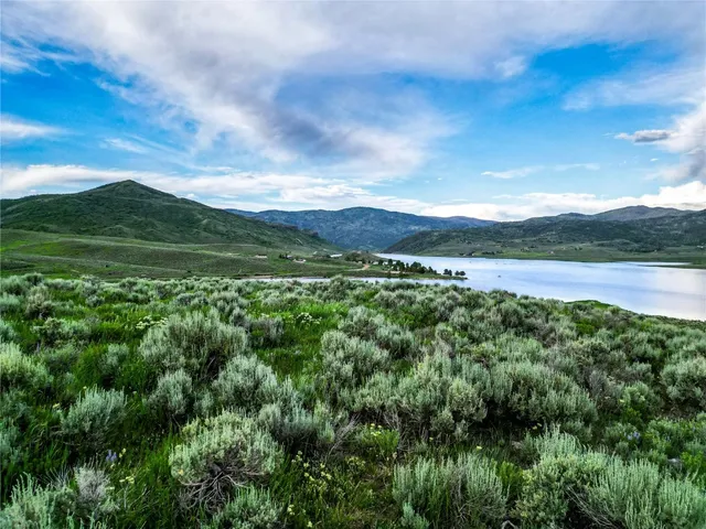 a view of mountain with lake view