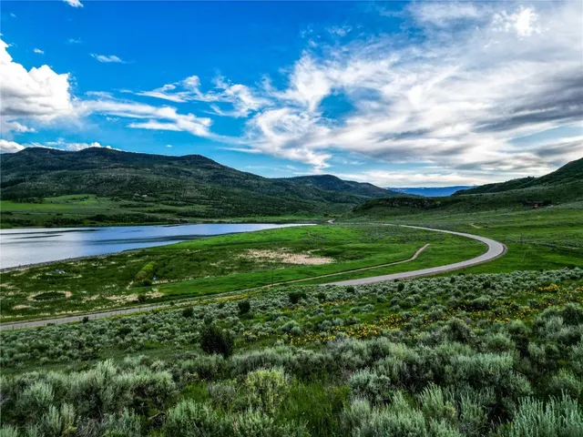 a view of a golf course with a lake