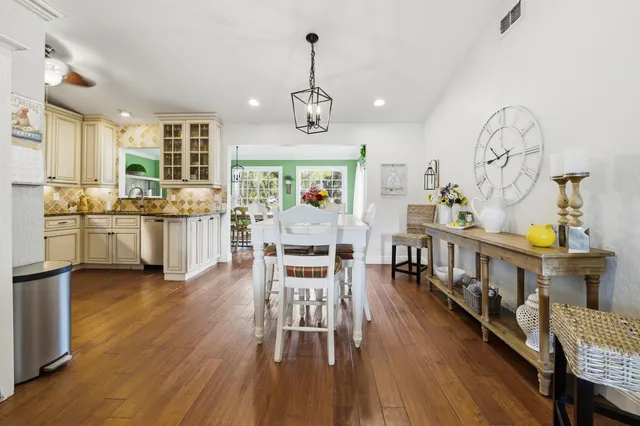 a kitchen with stainless steel appliances granite countertop a stove and a sink