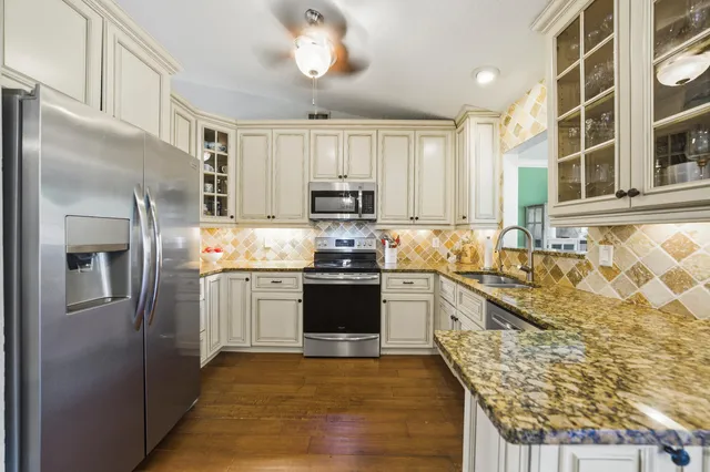 a dining room with furniture window and wooden floor