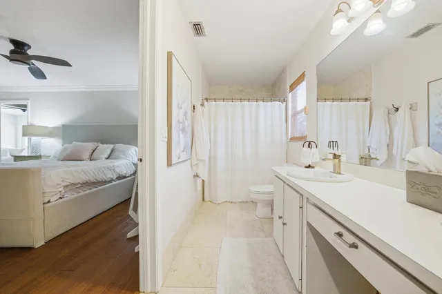 a view of walk in closet with clothes