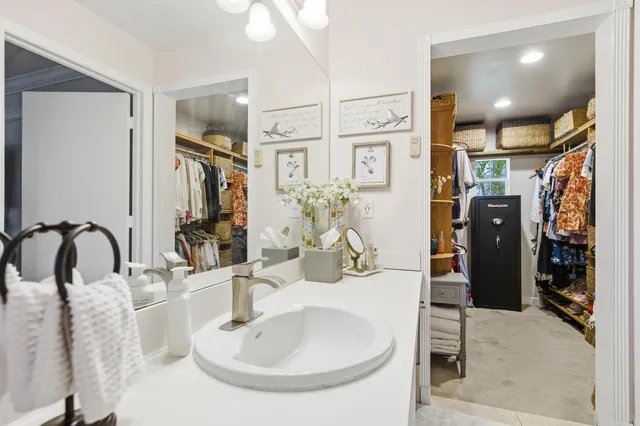 a bedroom with a bed couch and window
