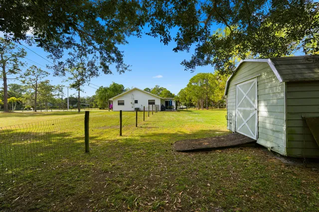 a view of a house with a big yard