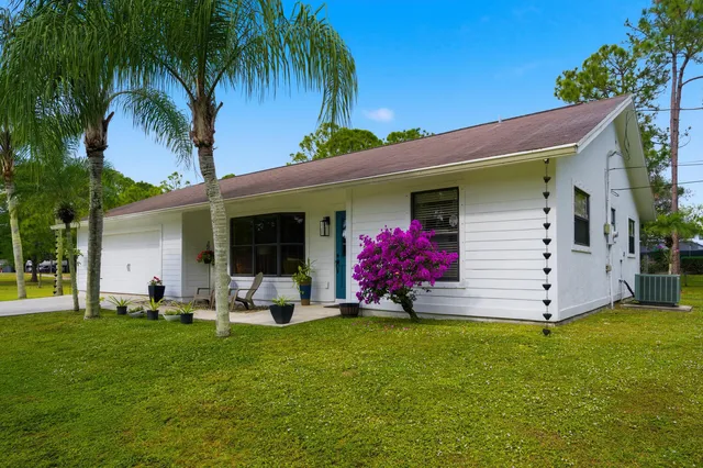 a view of a backyard with a patio