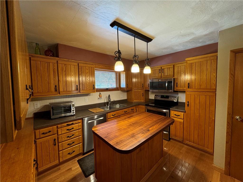 612 College Lodge Road Indiana, PA 15701 - Photo 12 of 31 a kitchen with stainless steel appliances granite countertop a sink a stove and a refrigerator