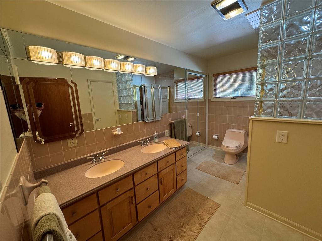 612 College Lodge Road Indiana, PA 15701 - Photo 13 of 31 a spacious bathroom with a sink a mirror and a toilet