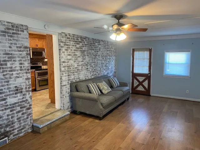 a living room with furniture and a fireplace