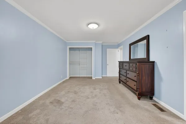 a view of an empty room with windows