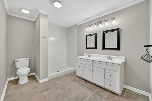 a bathroom with a sink and toilet