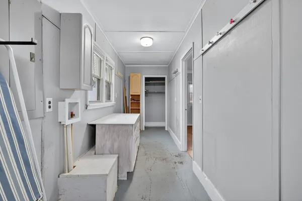 a view of a hallway with windows