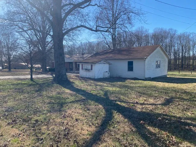 a house view with a backyard space