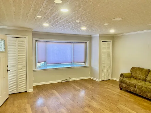 a view of livingroom with furniture wooden floor and window