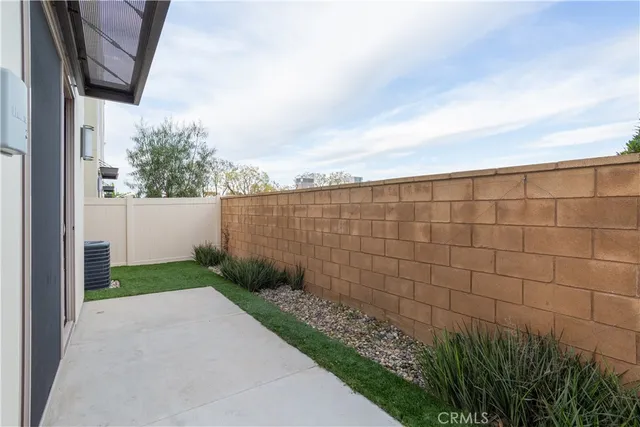 a view of a roof deck with table and chairs