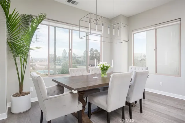 a view of a dining room with furniture window and outside view