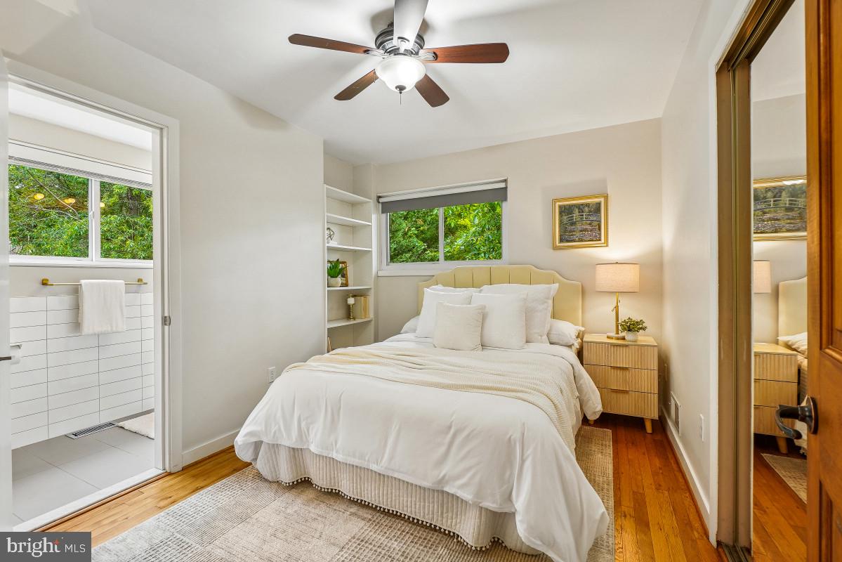827 Caddington Avenue Silver Spring, MD 20901 - Photo 21 of 45 a bedroom with a bed and a chandelier