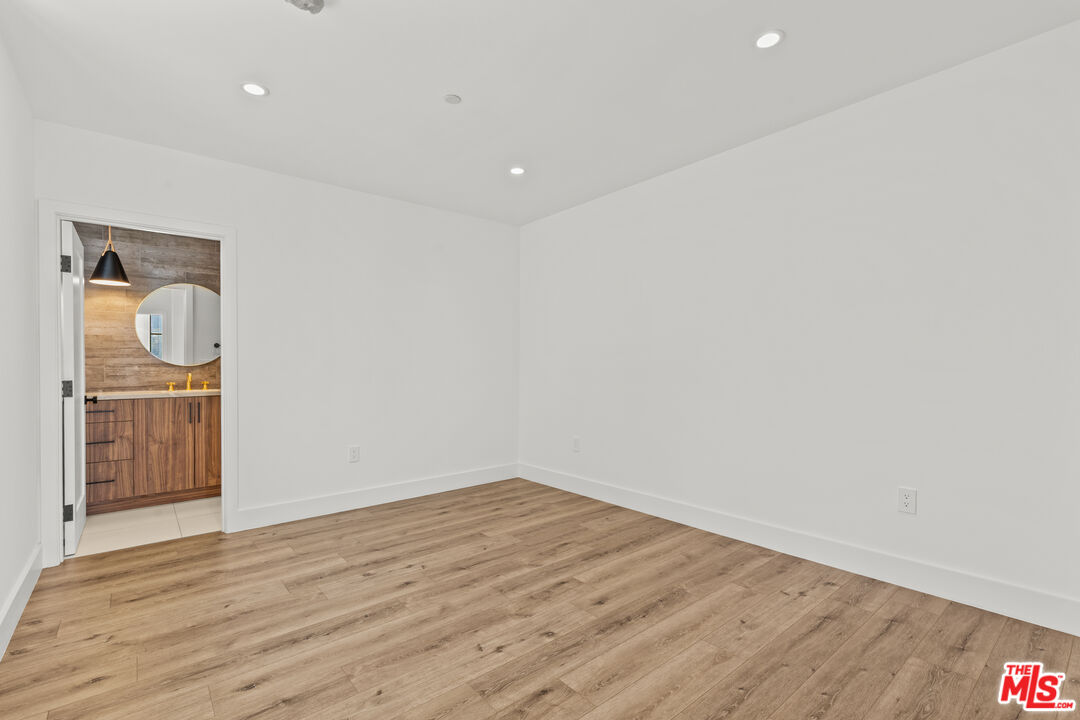 5536 Tova Road Sherman Oaks, CA 91411 - Photo 9 of 15 a view of empty room with wooden floor