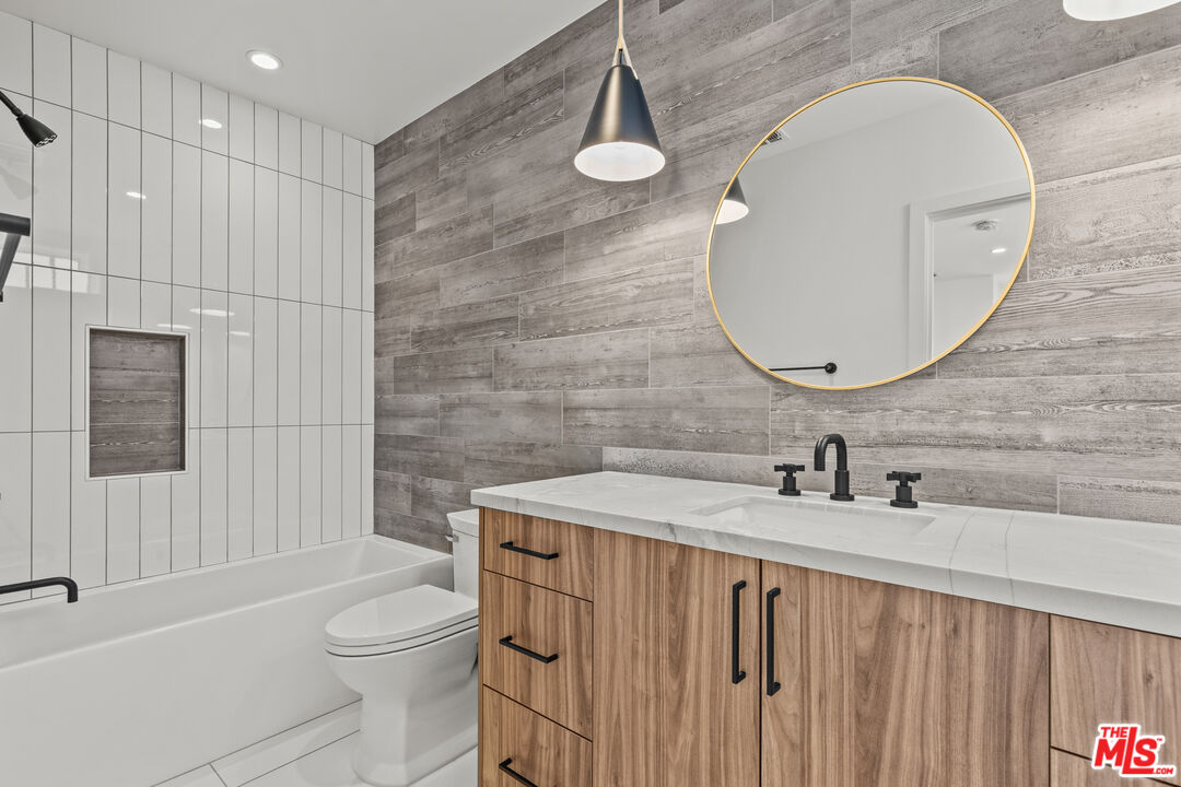 5536 Tova Road Sherman Oaks, CA 91411 - Photo 10 of 15 a bathroom with a sink a toilet and shower