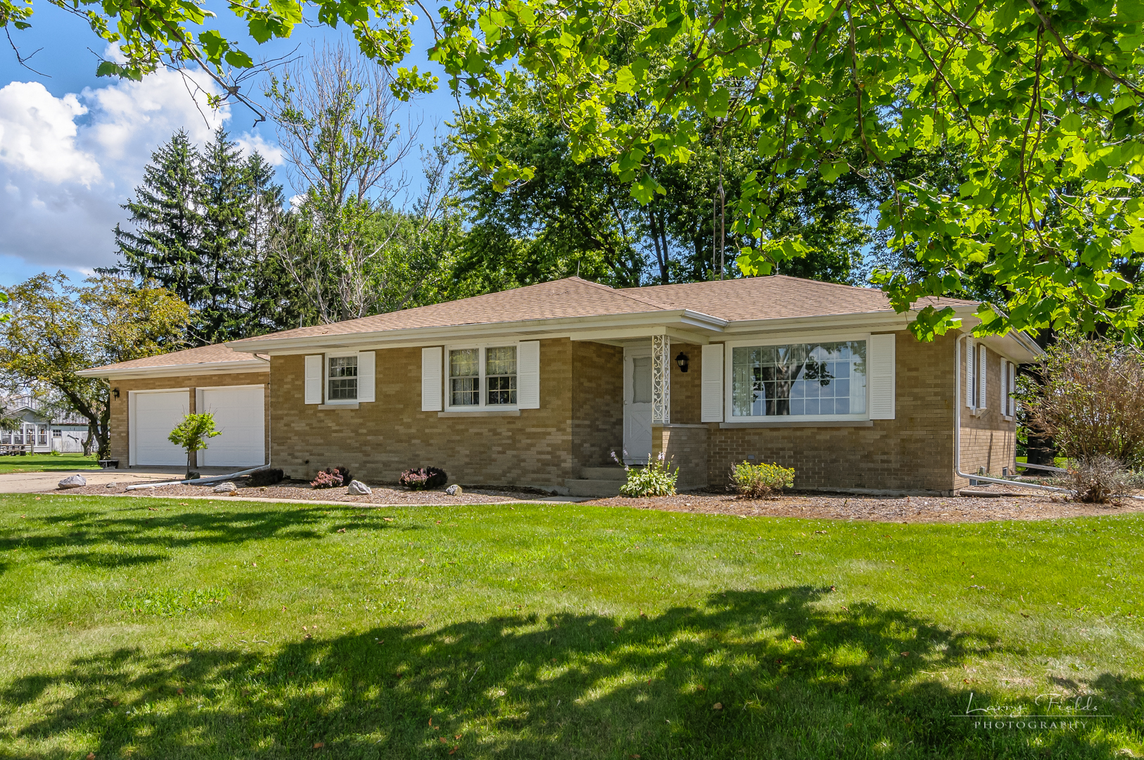 4682 East 29th Road Sandwich, IL 60548 - Photo 14 of 18 a front view of a house with a yard and trees