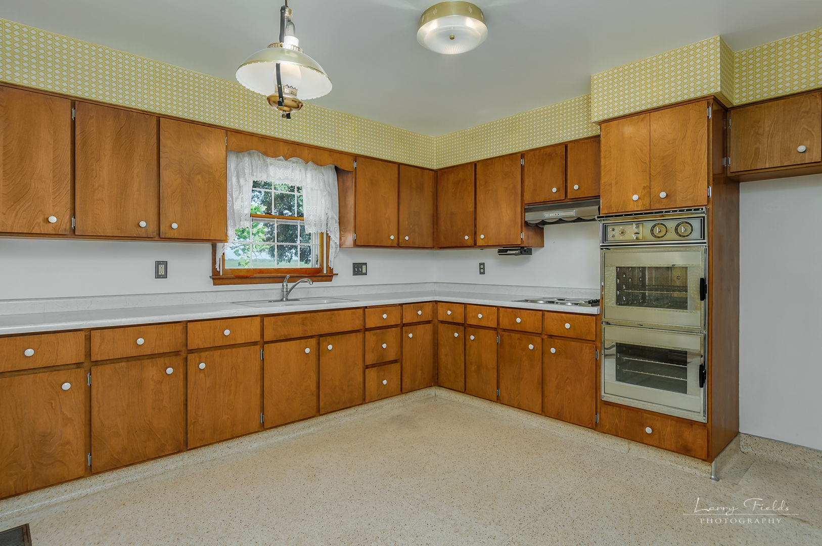 4682 East 29th Road Sandwich, IL 60548 - Photo 4 of 18 a kitchen with stainless steel appliances granite countertop a sink cabinets and a window