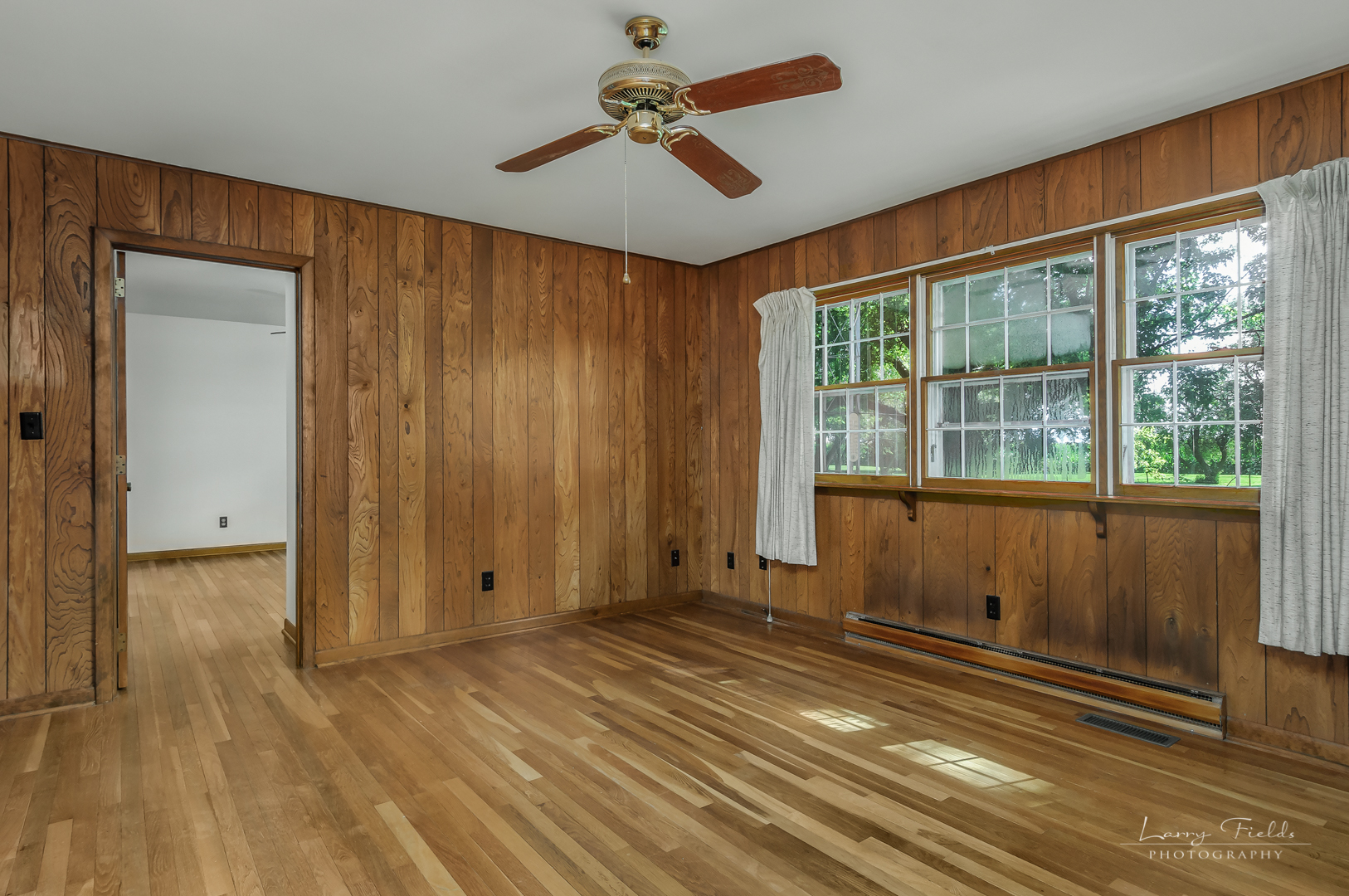 4682 East 29th Road Sandwich, IL 60548 - Photo 8 of 18 an empty room with wooden floor and windows