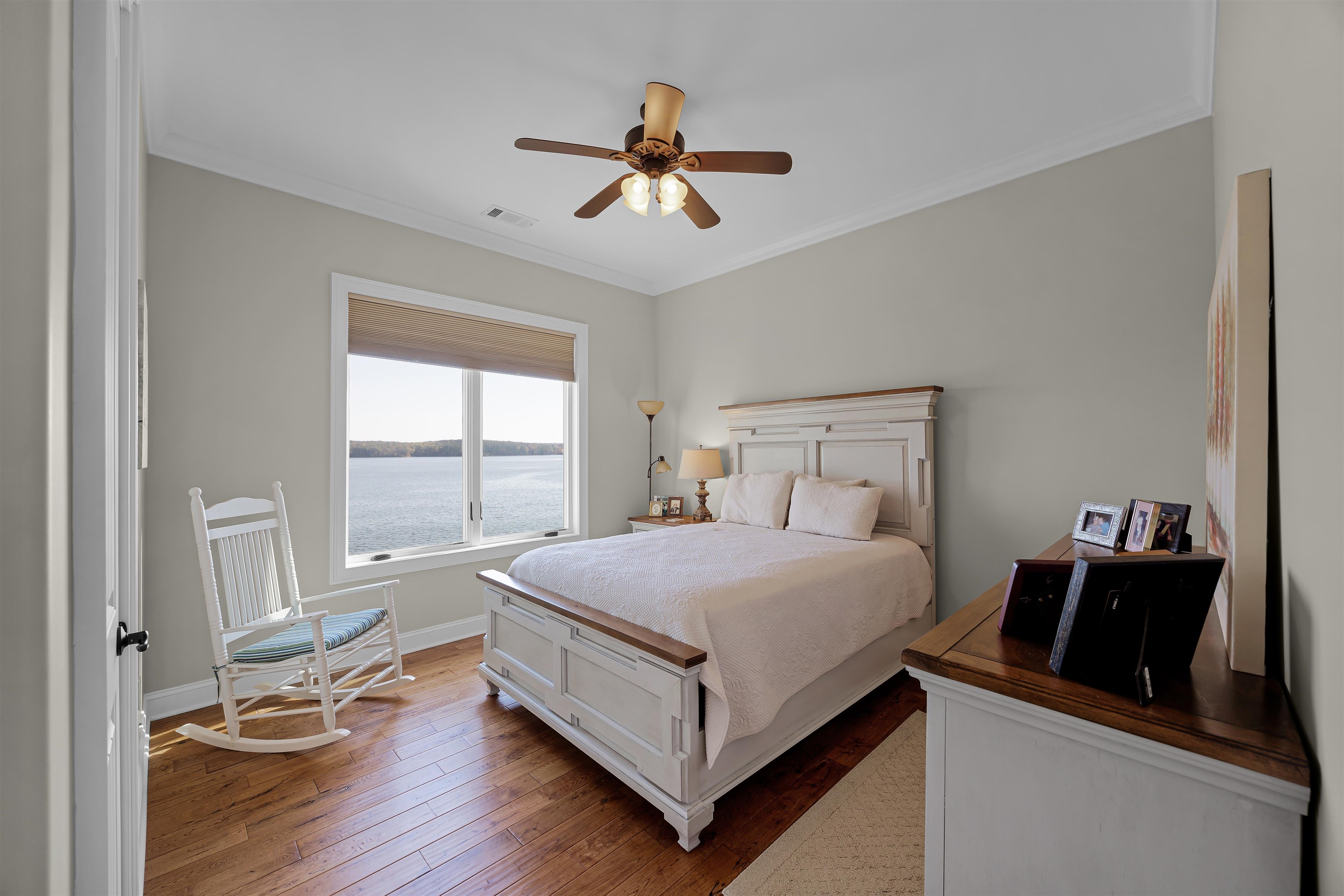 45 Pinnacle Pointe Savannah, TN 38372 - Photo 27 of 30 Bedroom with wood-type flooring, ornamental molding, and a ceiling fan